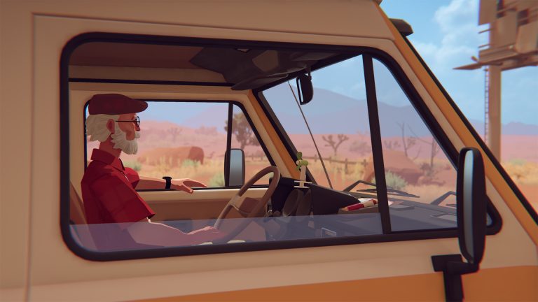 Older Alfred at the wheel of his camper van on a desert road