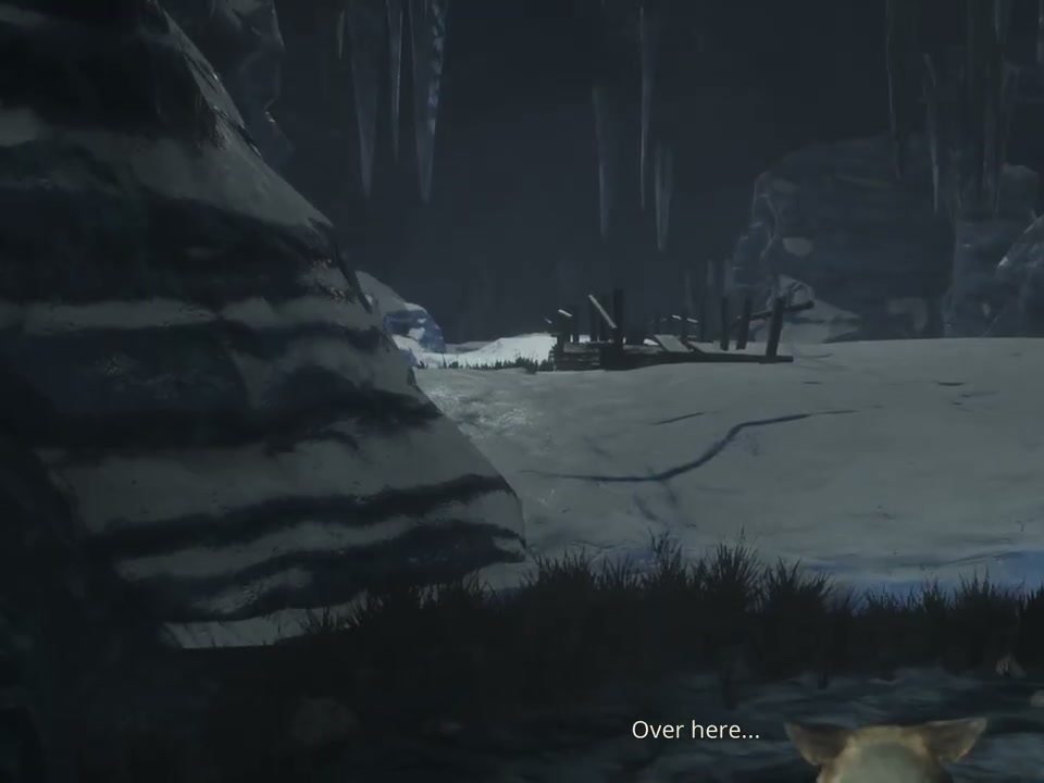A snowy cave approach beside broken wooden structures during the storm