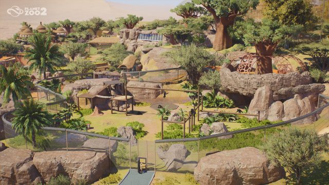 Land habitats, guest paths and sheltered viewing areas in a Planet Zoo 2 zoo
