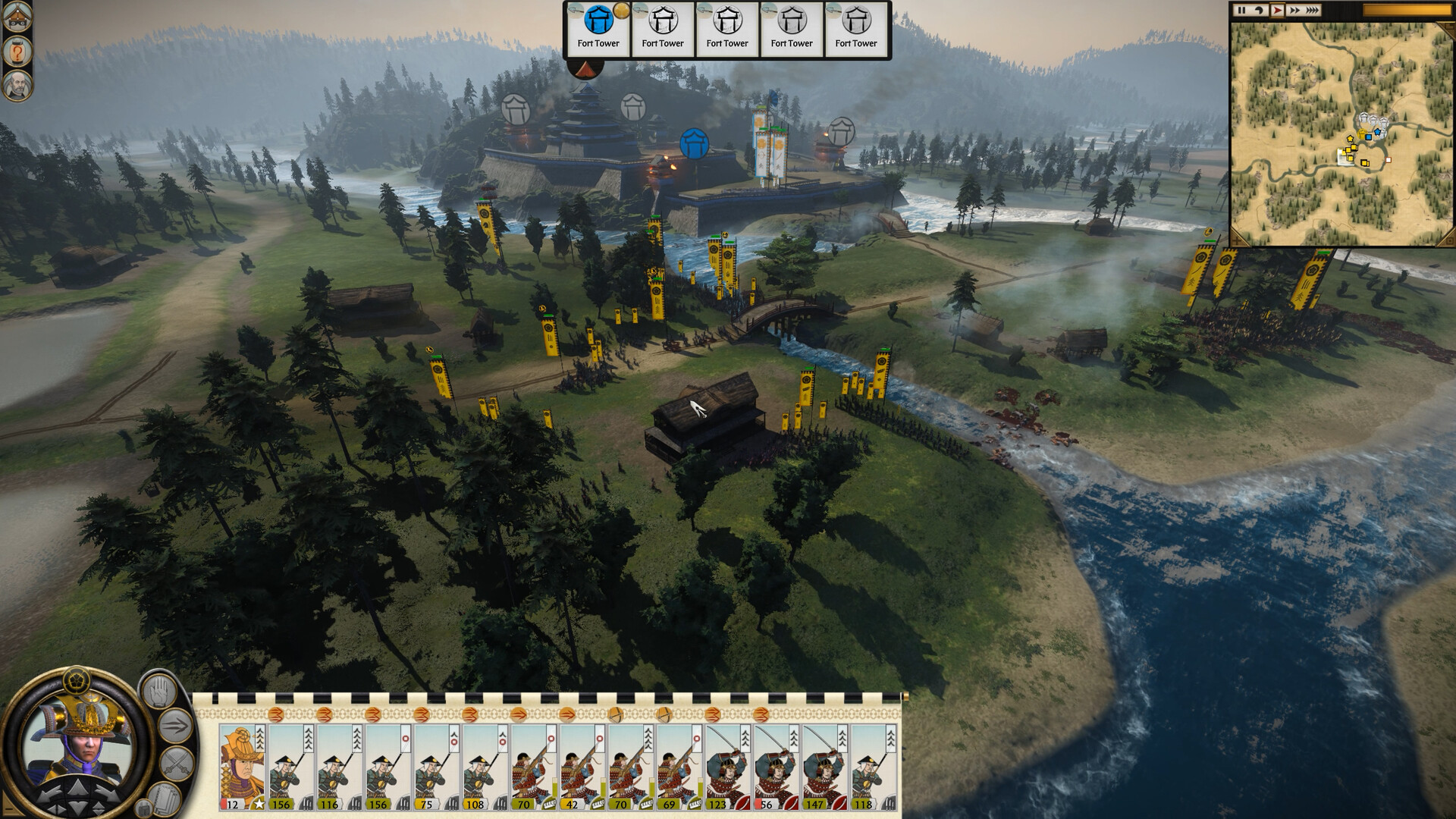 Army approaching a multi-level Japanese castle during a siege battle