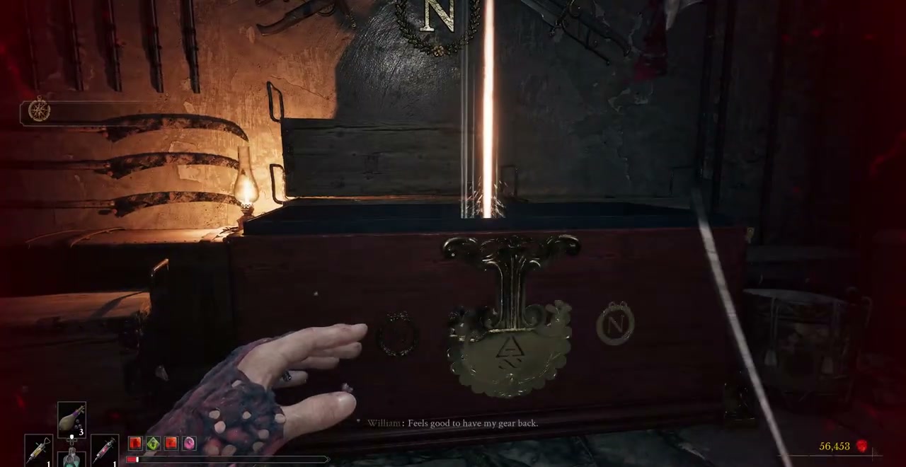 The equipment chest beside a torch inside the jail armoury